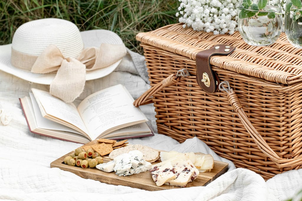 cottagecore things to do in the cotswolds white and brown wicker basket with white textile